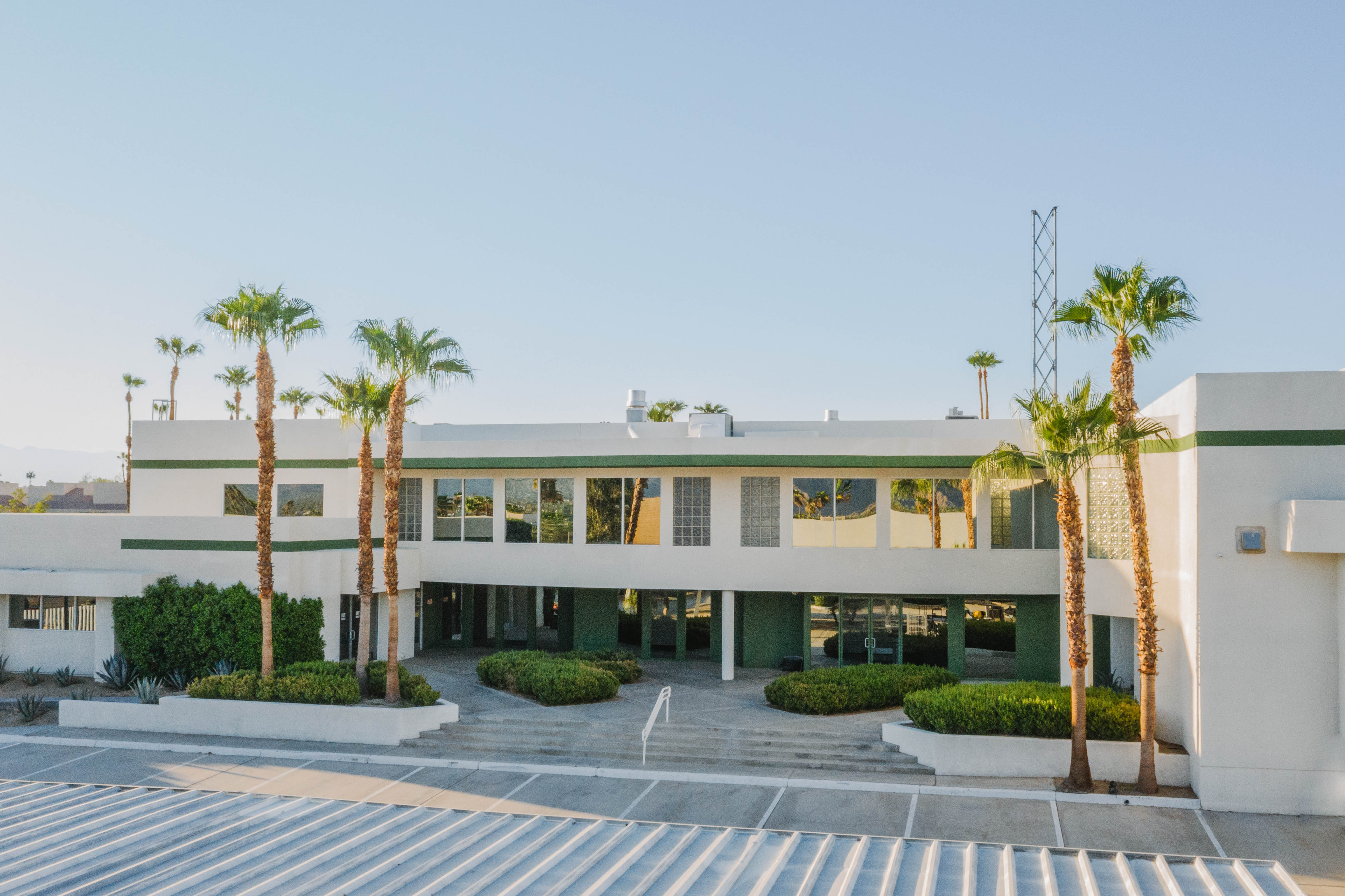 42650 Melanie Place exterior — modern commercial building with palm trees