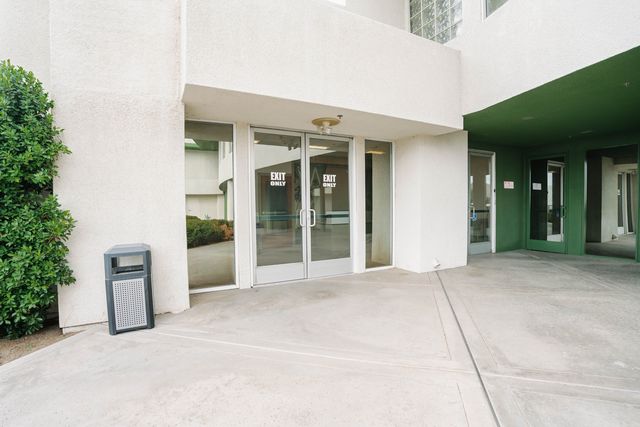 Glass entry doors and covered entrance
