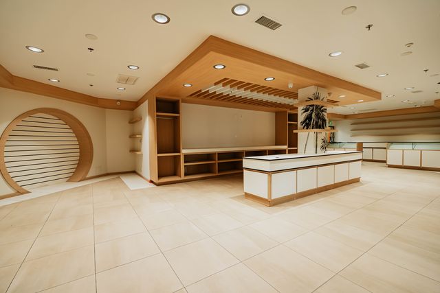Open showroom floor with center island and built-in shelving