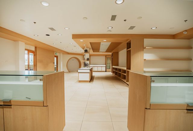 View through glass display cases toward center island